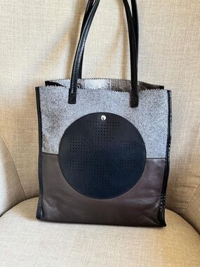 Tory Burch Tri Color Tote bag crafted from gray wool felt and brown leather